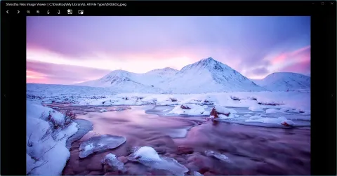 The image viewer showing a snowy mountain at sunset, with buttons for previous, next, zoom, rotate and more